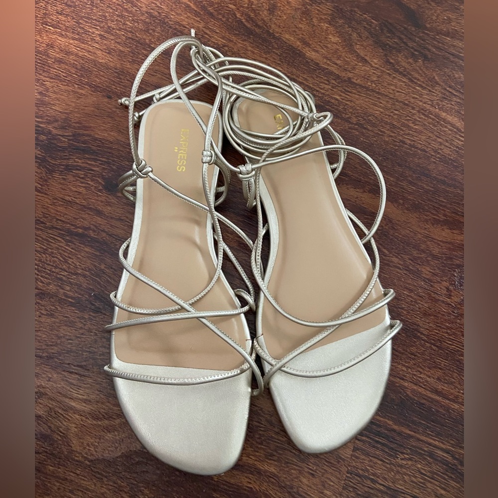 Never worn express tie up sandals in rose gold, size 7